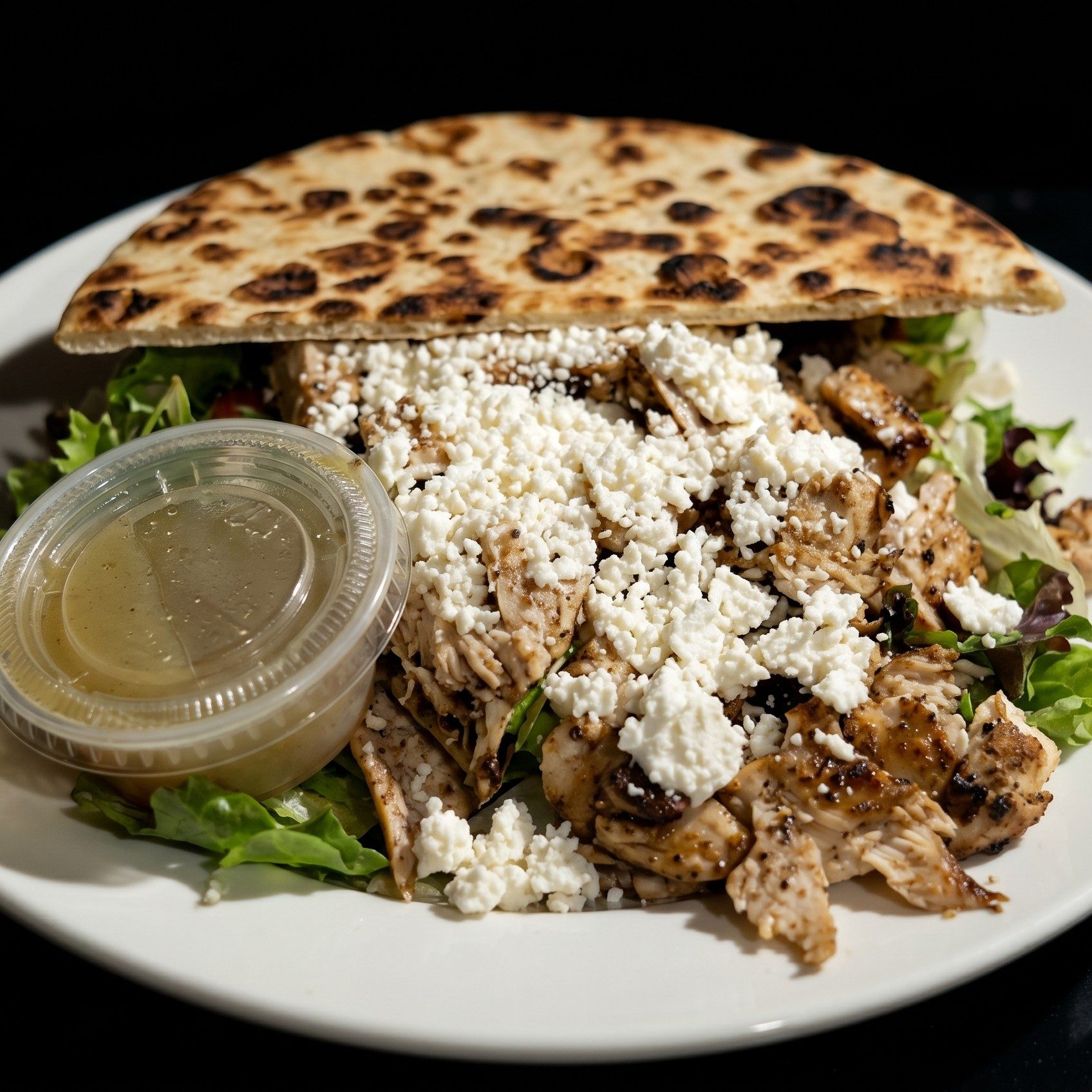 Chicken Souvlaki Salad with Pita.